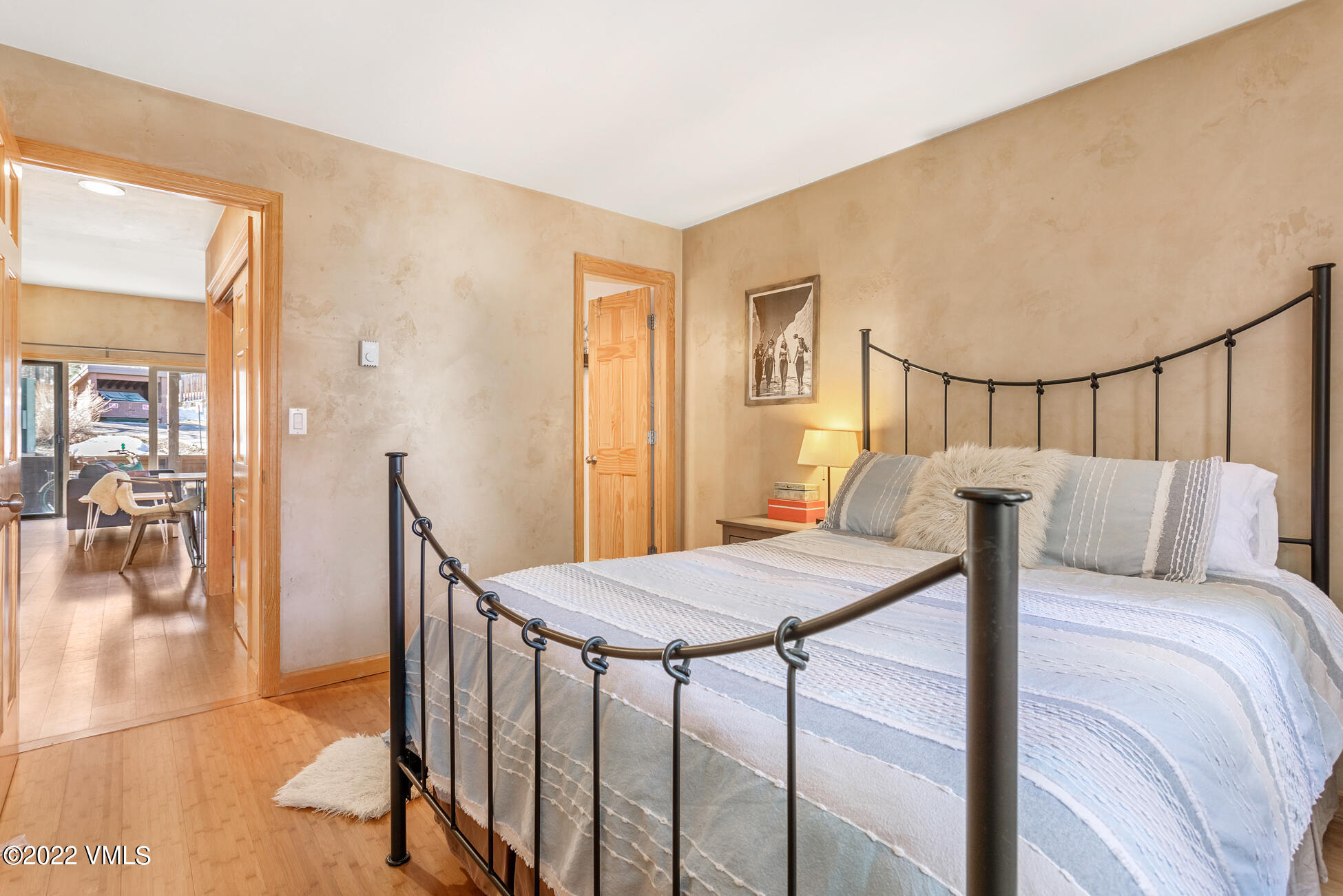195 Gopher Road, Unit 39 Avon, CO 81620 - Photo 4 of 24 a bedroom with a bed and wooden floor