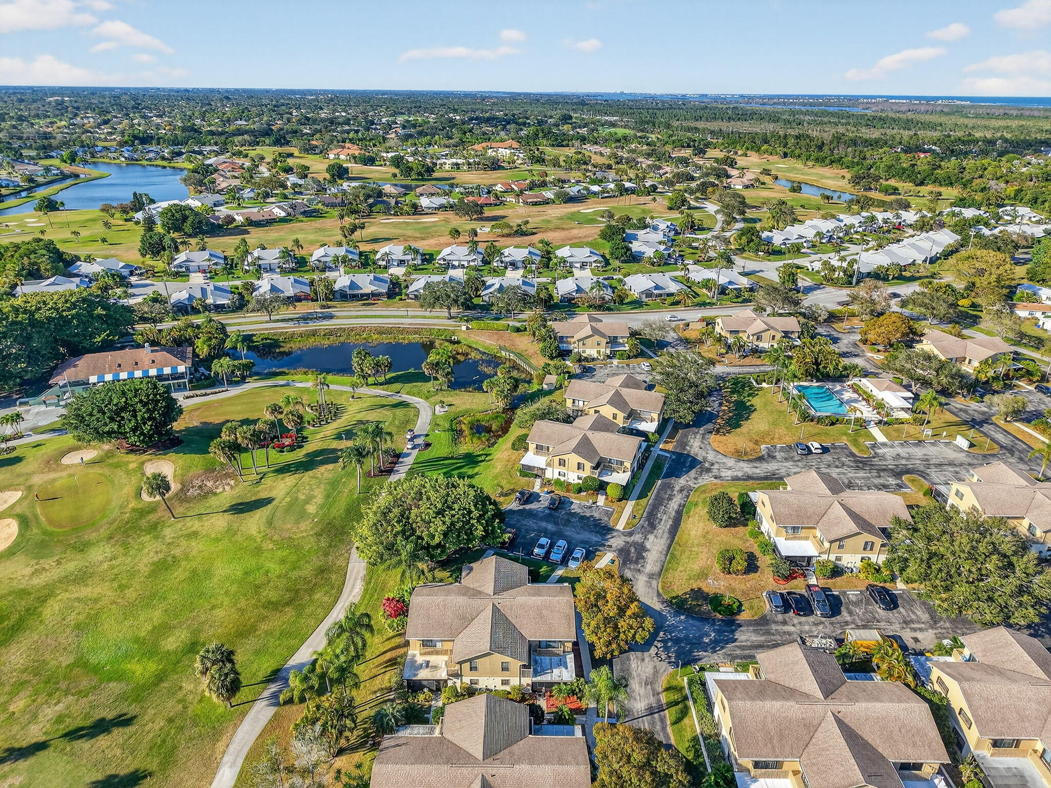 7382 Southeast Jamestown Terrace Hobe Sound, FL 33455 - Photo 31 of 33 an aerial view of residential houses with outdoor space