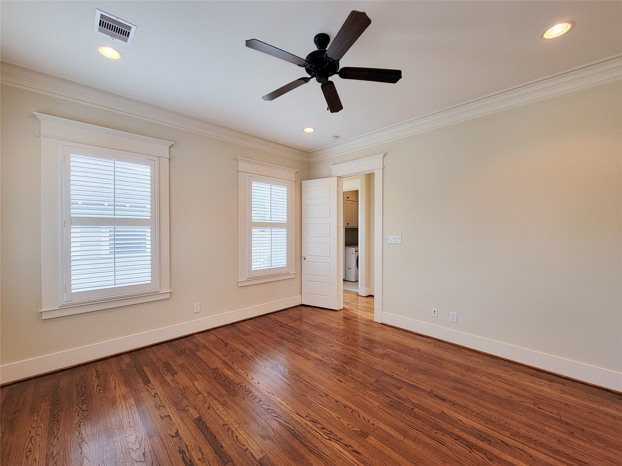 1140 West Cottage Street Houston, TX 77009 - Photo 24 of 37 a view of an empty room with wooden floor and a window