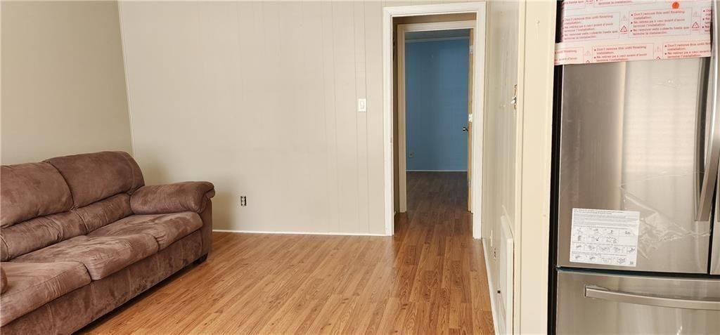 205 Glenview Terrace Winder, GA 30680 - Photo 19 of 31 a living room with furniture and a wooden floor