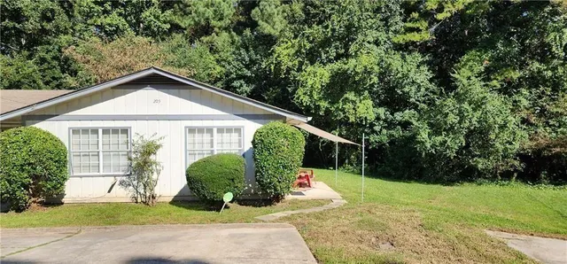 a kitchen with stainless steel appliances granite countertop white cabinets and a refrigerator