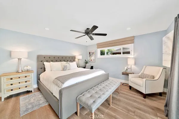 a bedroom with a large bed and a window