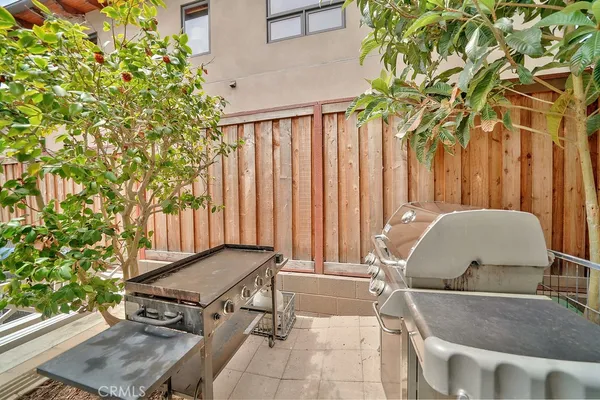 a backyard of a house with outdoor seating