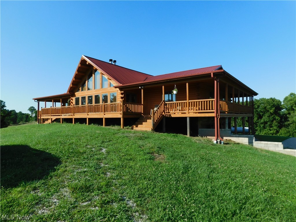 3354 Rising Sun Ridge Road Walker, WV 26180 - Photo 6 of 26 Angled view showing the garage area entrance as well.