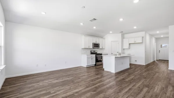 a view of kitchen with wooden floor