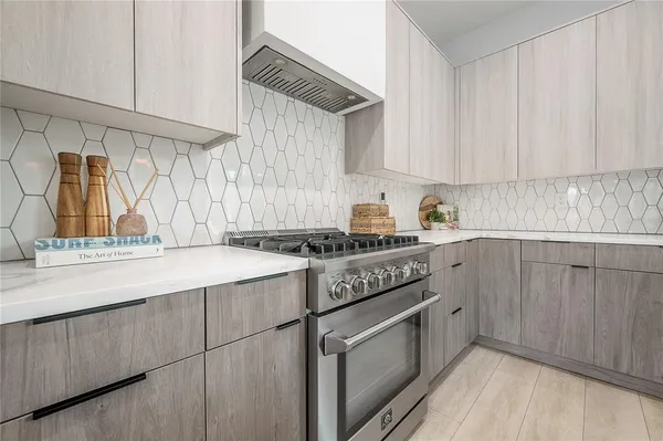 a kitchen with a sink cabinets and window