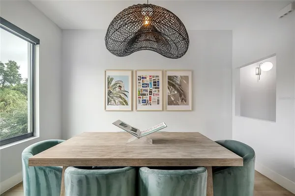 a bedroom with a table and window