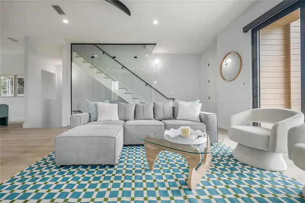 a living room with furniture and a large window