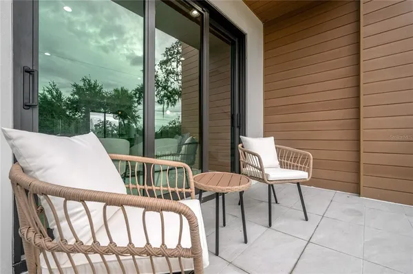 a view of a patio with a table and chairs