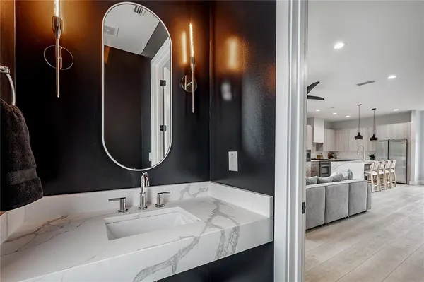a bathroom with a sink and mirror