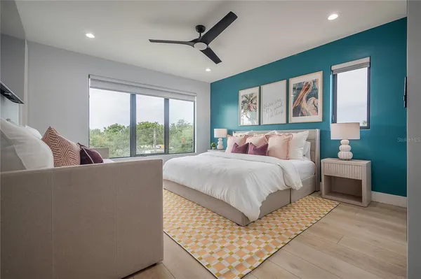 a bedroom with bed and window