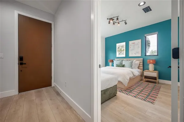 a bedroom with a bed and a window