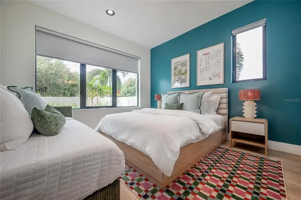 a bedroom with bed and a window