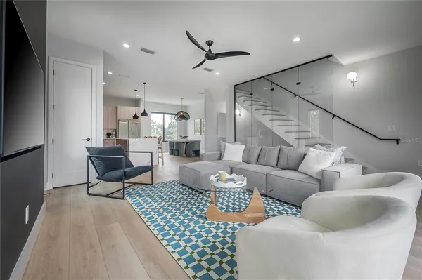 a living room with furniture and a rug