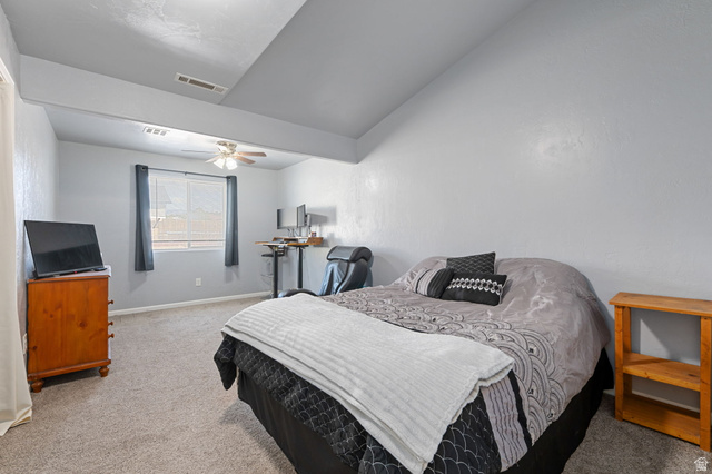 348 North Lodge Road Central, UT 84722 - Photo 9 of 25 Bedroom with light colored carpet, a ceiling fan, and lofted ceiling