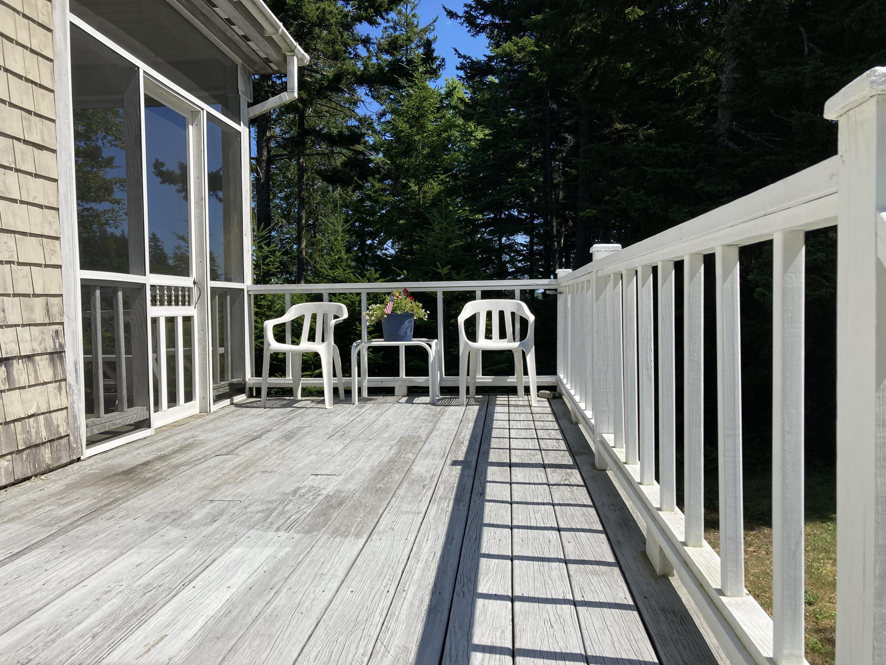 207 Goods Point Road Steuben, ME 04680 - Photo 28 of 56 Open deck next to screened porch.
