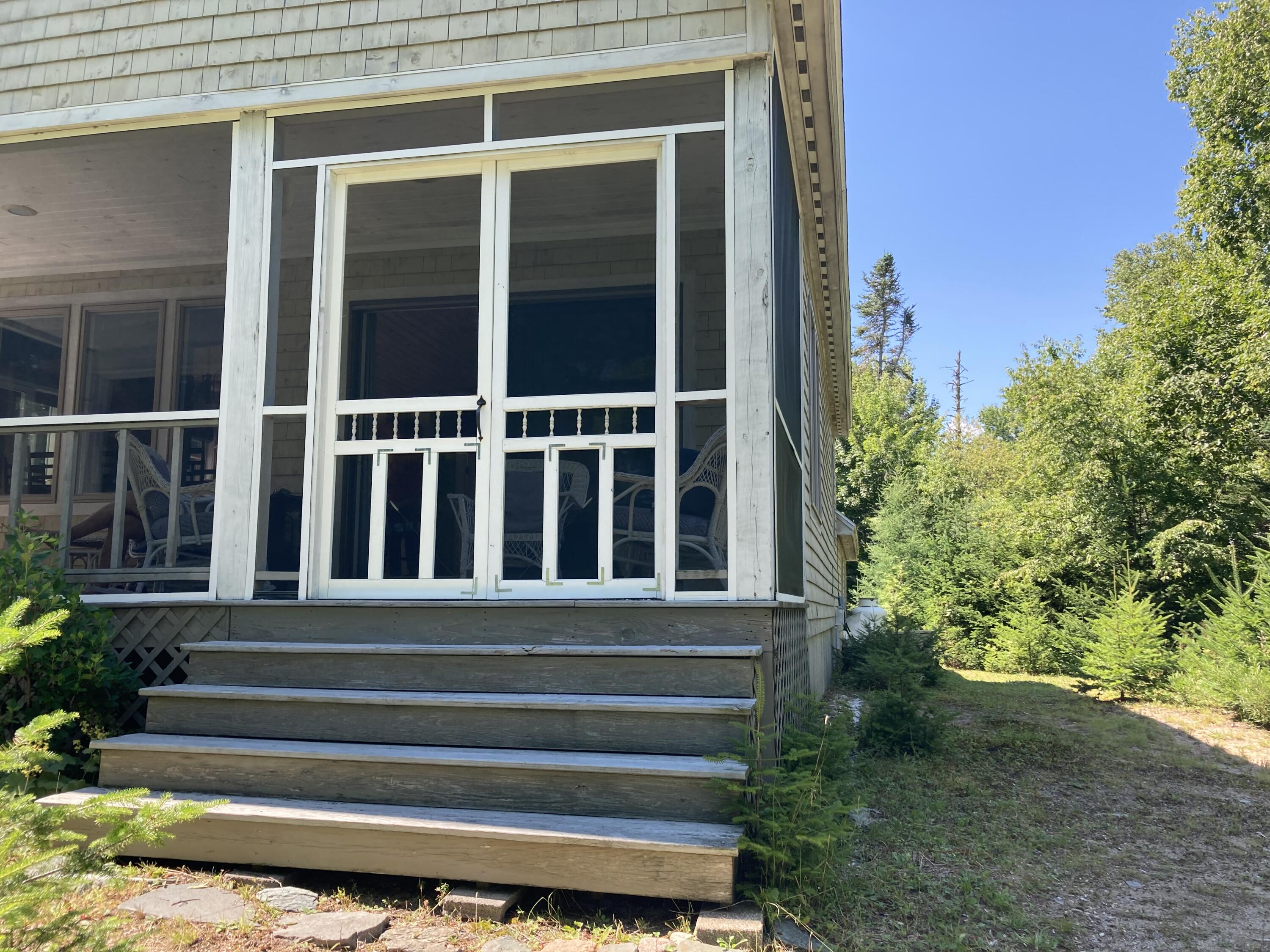 207 Goods Point Road Steuben, ME 04680 - Photo 30 of 56 Screened porch entrance from shore path.