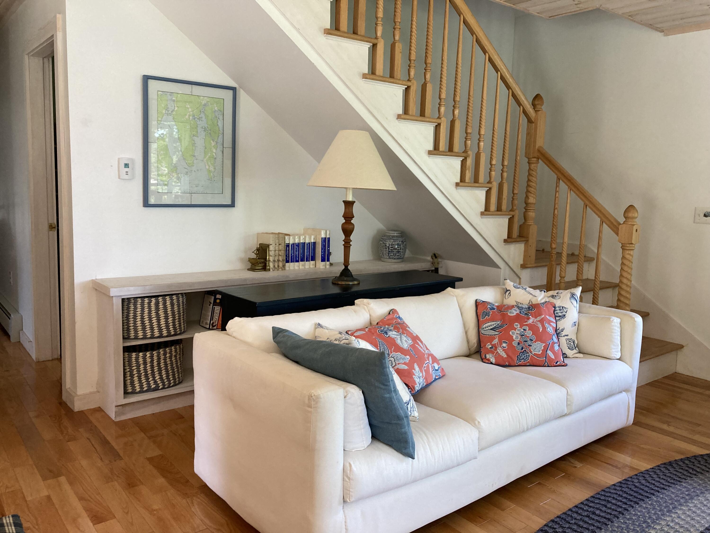 207 Goods Point Road Steuben, ME 04680 - Photo 10 of 56 Living room with open stairwell.