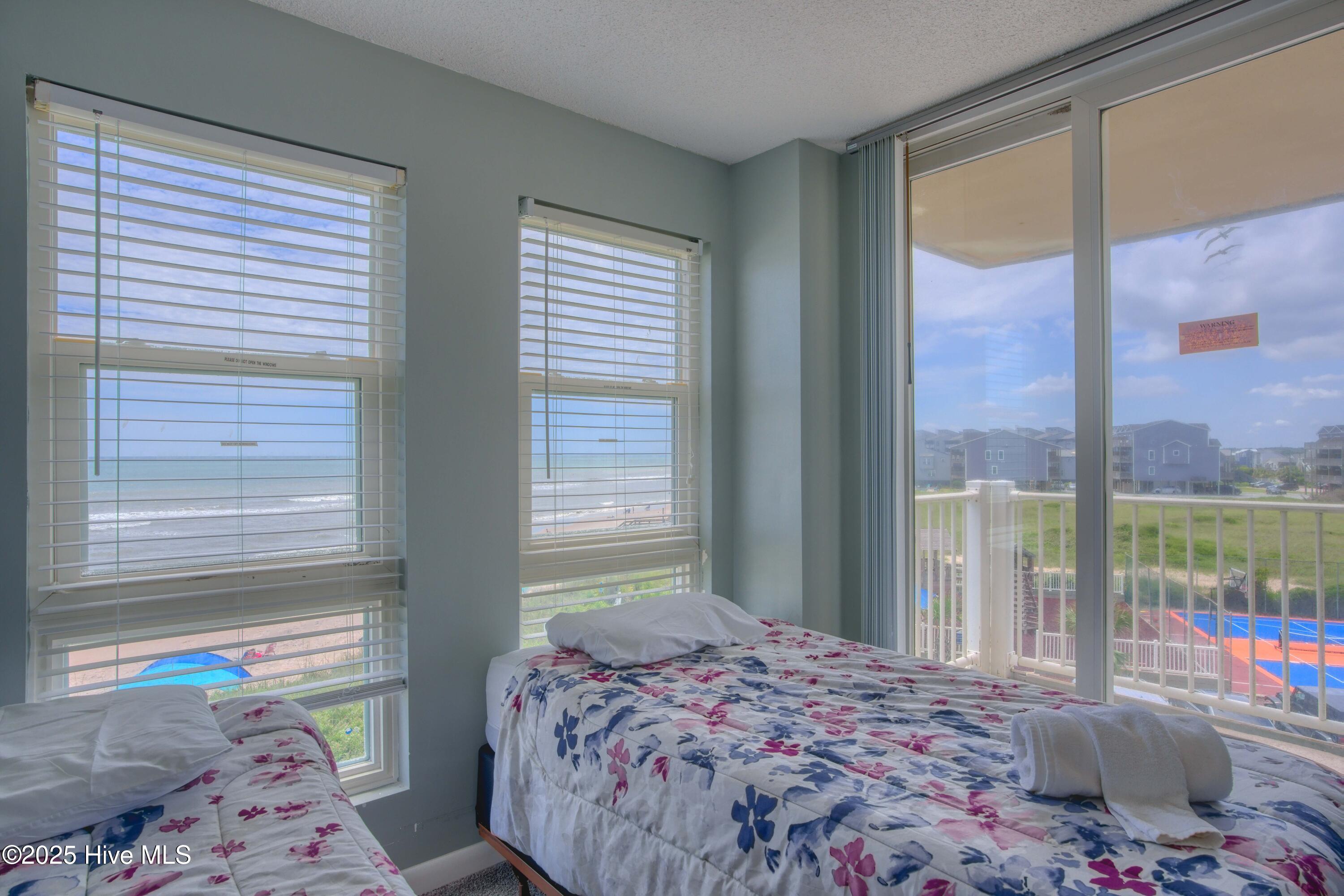 2000 New River Inlet Road, Unit 1207 North Topsail Beach, NC 28460 - Photo 15 of 30 1207 St. Regis - Living room and Bedroom