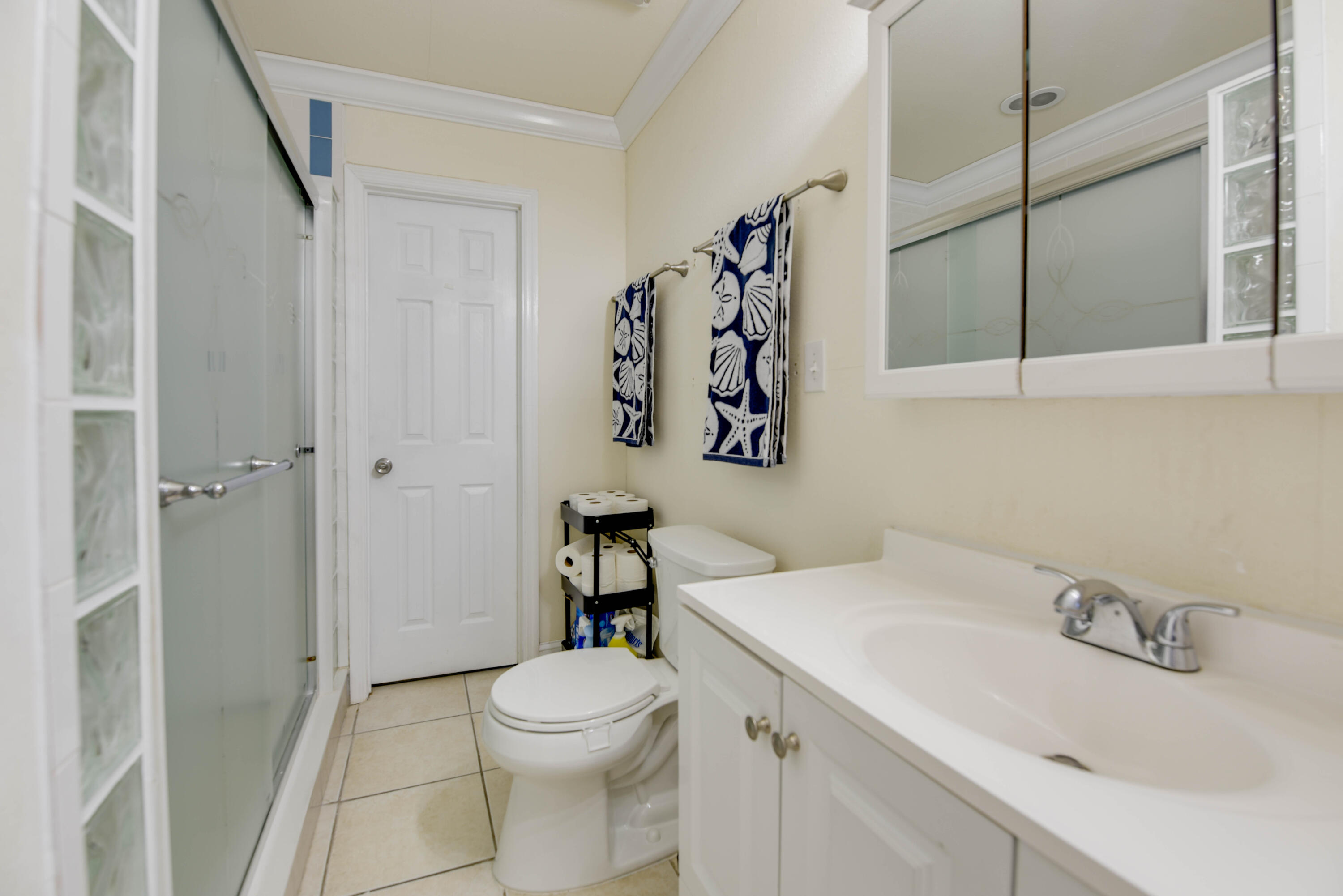1524 5th Street Key West, FL 33040 - Photo 14 of 31 a bathroom with a sink toilet and shower