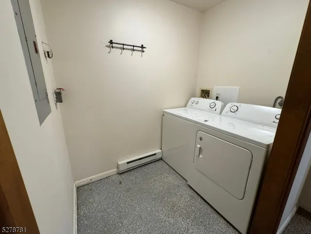 a bathroom with a double vanity sink toilet and shower