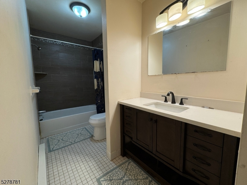 261 Old Chimney Ridge Road, Unit A Montague, NJ 07827 - Photo 22 of 43 a bathroom with a double vanity sink toilet and shower