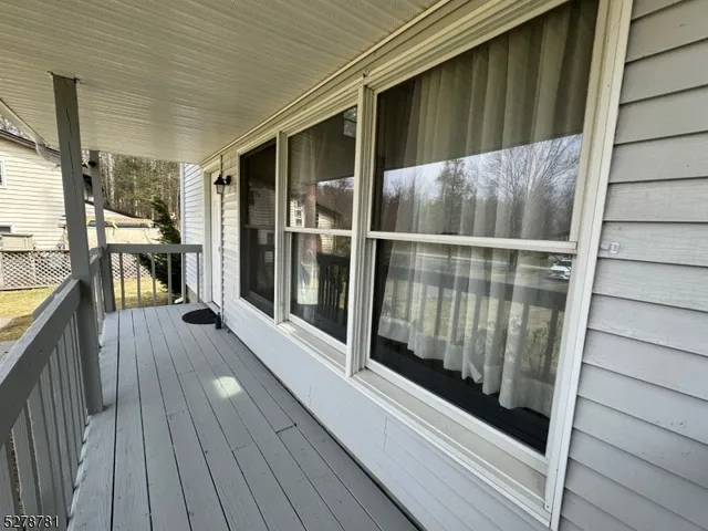 a front view of house with yard and trees