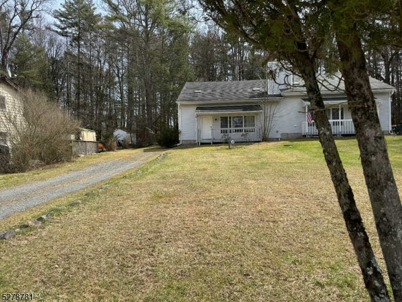 261 Old Chimney Ridge Road, Unit A Montague, NJ 07827 - Photo 32 of 43 a front view of a house with a yard