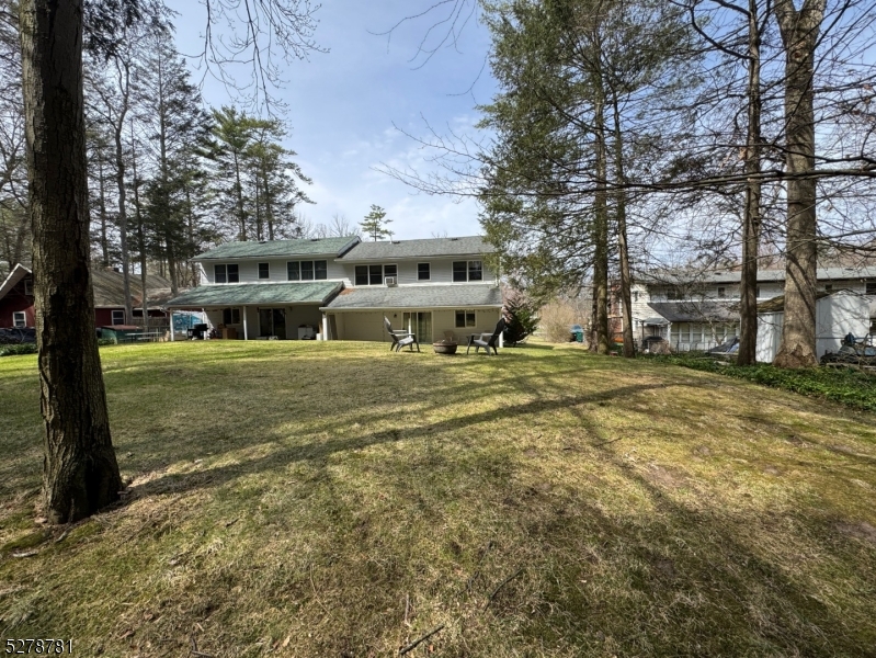 261 Old Chimney Ridge Road, Unit A Montague, NJ 07827 - Photo 39 of 43 a view of a house with a yard
