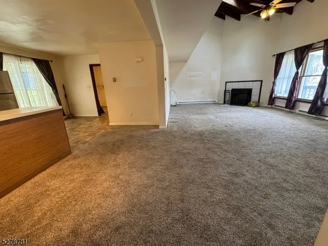 a kitchen with stainless steel appliances granite countertop a refrigerator a stove top oven a sink and dishwasher