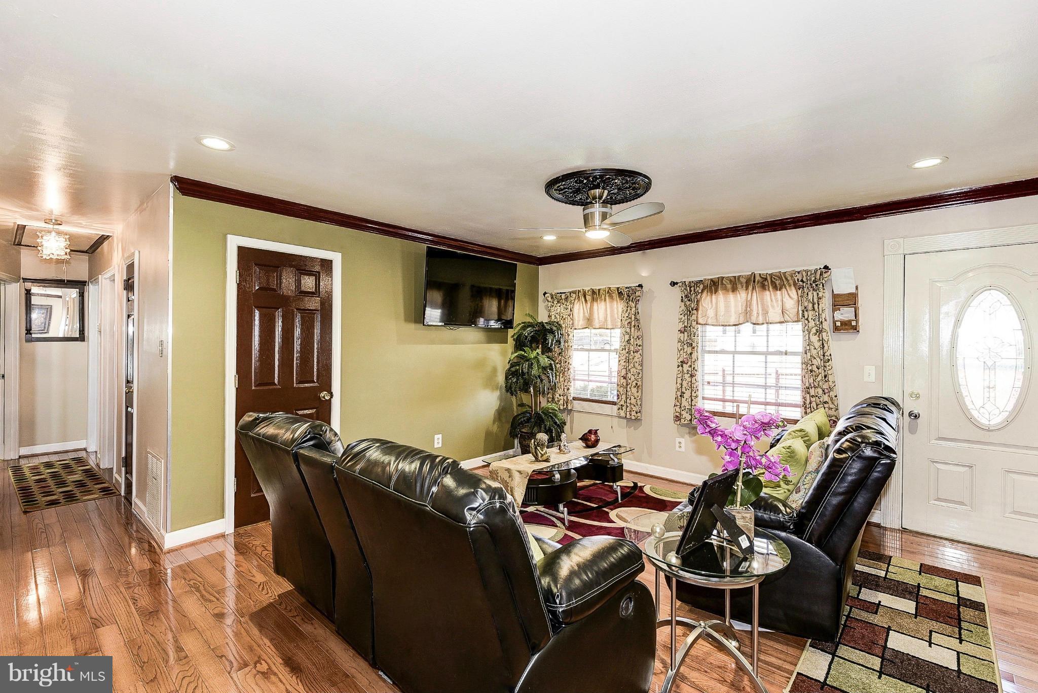 12301 Bluhill Road Silver Spring, MD 20902 - Photo 4 of 13 a living room with furniture and a large window