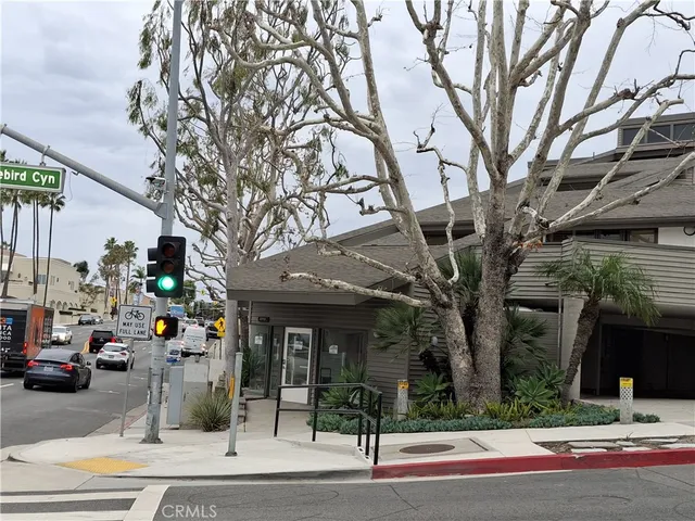 a view of street along with parked cars