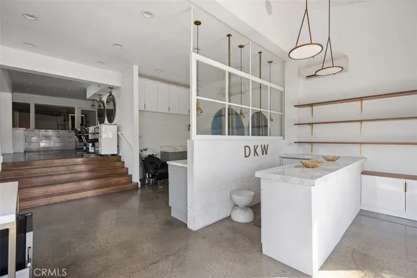 a view of living room with furniture and fireplace
