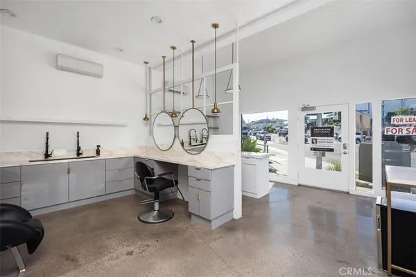 a very nice looking room with a large window and cars