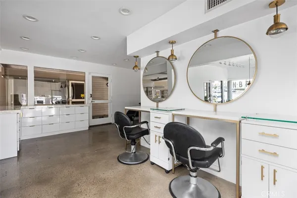 a living room with furniture a mirror and a large window
