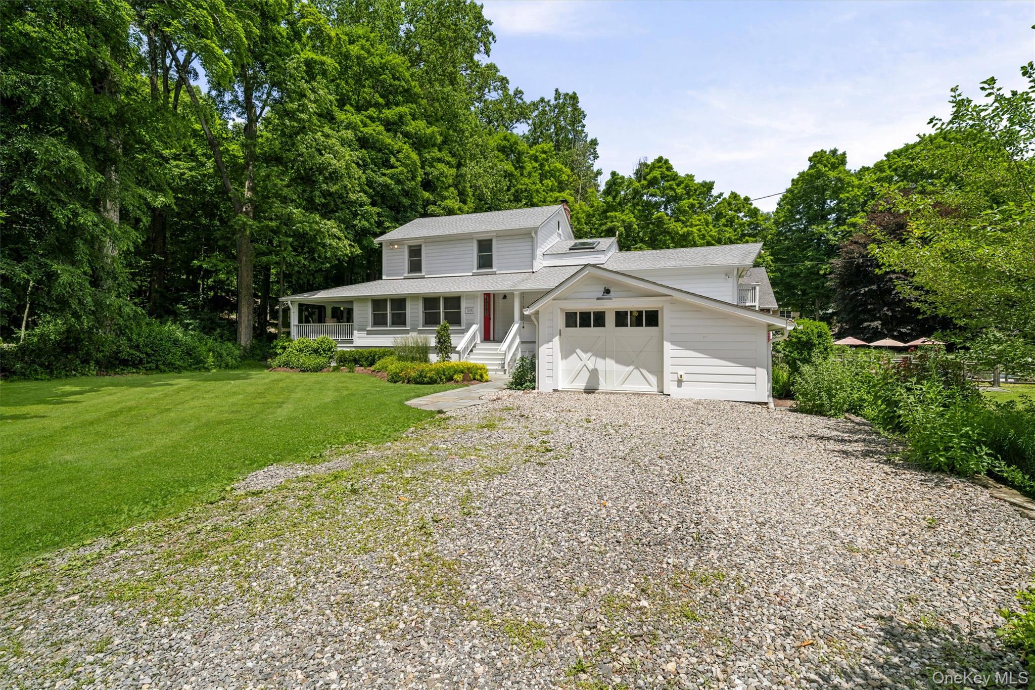 324 Haverstraw Road Suffern, NY 10901 - Photo 3 of 50 a house with green field in front of it