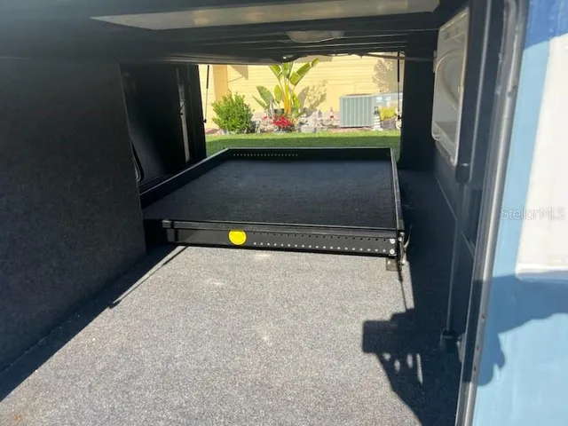 a view of a room with wooden walls