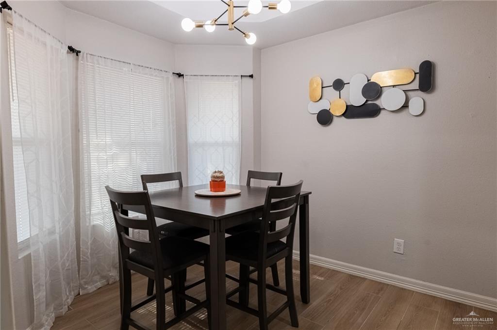 101 Apollo Drive Donna, TX 78537 - Photo 4 of 11 a view of a dining room with furniture and chandelier