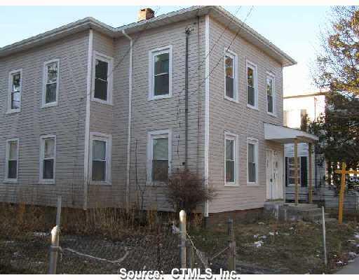 219 Newfield Avenue Bridgeport, CT 06607 - Photo 1 of 1 a front view of a house with yard