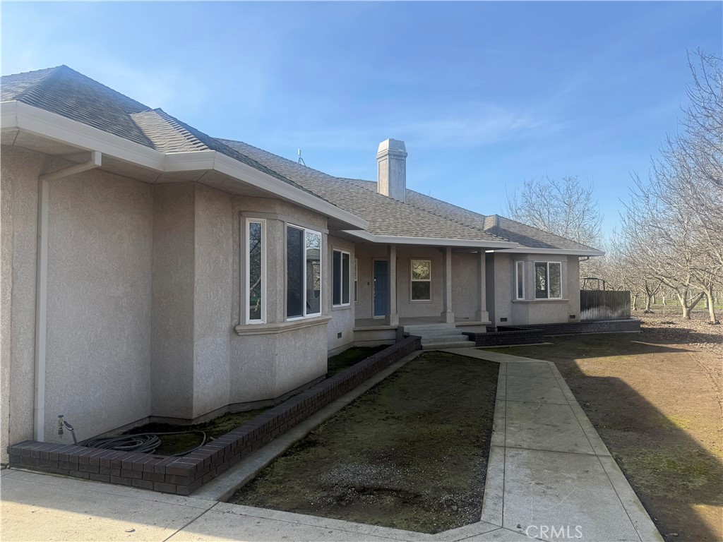 a front view of a house with yard