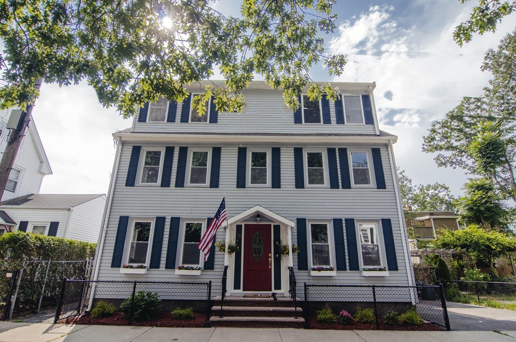 16 Port Norfolk Street, Unit 2 Boston, MA 02122 - Photo 1 of 13 a front view of residential houses with yard and green space