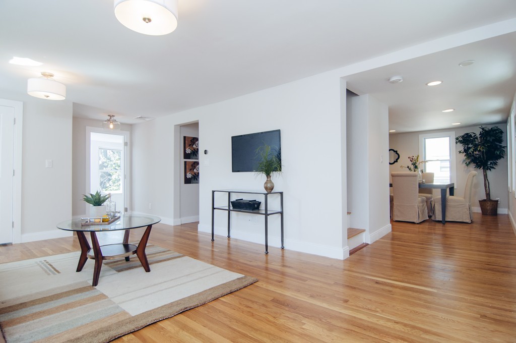 16 Port Norfolk Street, Unit 2 Boston, MA 02122 - Photo 3 of 13 a living room with furniture and a flat screen tv