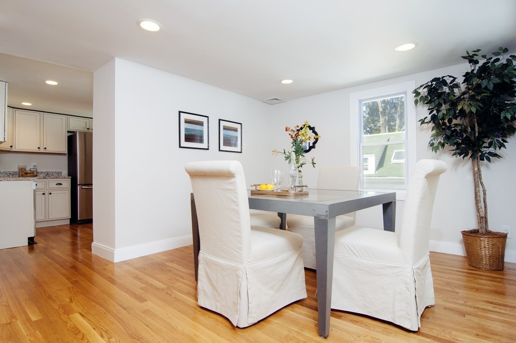 16 Port Norfolk Street, Unit 2 Boston, MA 02122 - Photo 7 of 13 a living room with furniture and a table