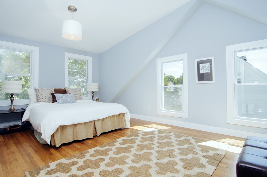 16 Port Norfolk Street, Unit 2 Boston, MA 02122 - Photo 8 of 13 a bedroom with a bed and a window