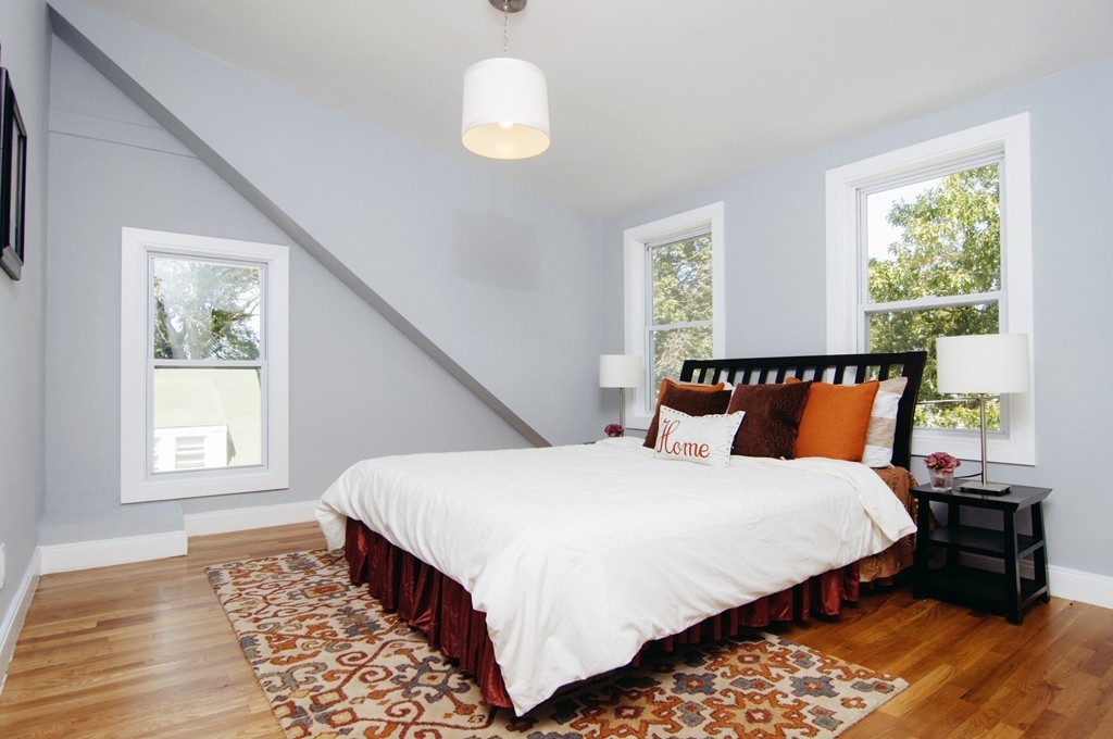 16 Port Norfolk Street, Unit 2 Boston, MA 02122 - Photo 9 of 13 a bedroom with bed and window