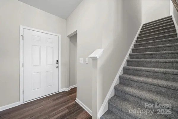 a view of entryway with wooden floor