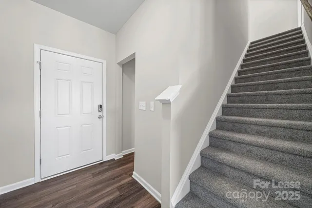 a view of entryway with wooden floor