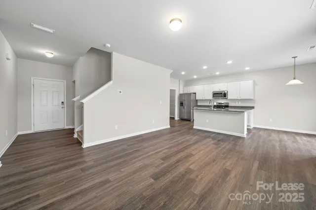 a view of kitchen with wooden floor