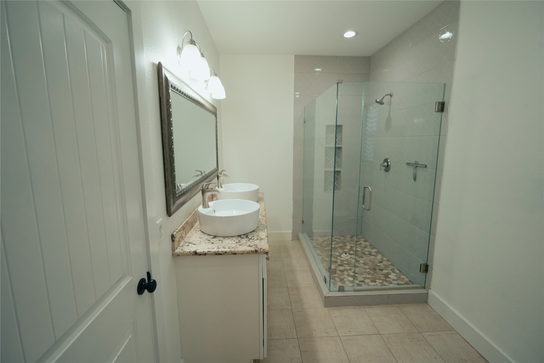5105 Chapman Street Houston, TX 77009 - Photo 15 of 49 a bathroom with a sink a toilet and shower
