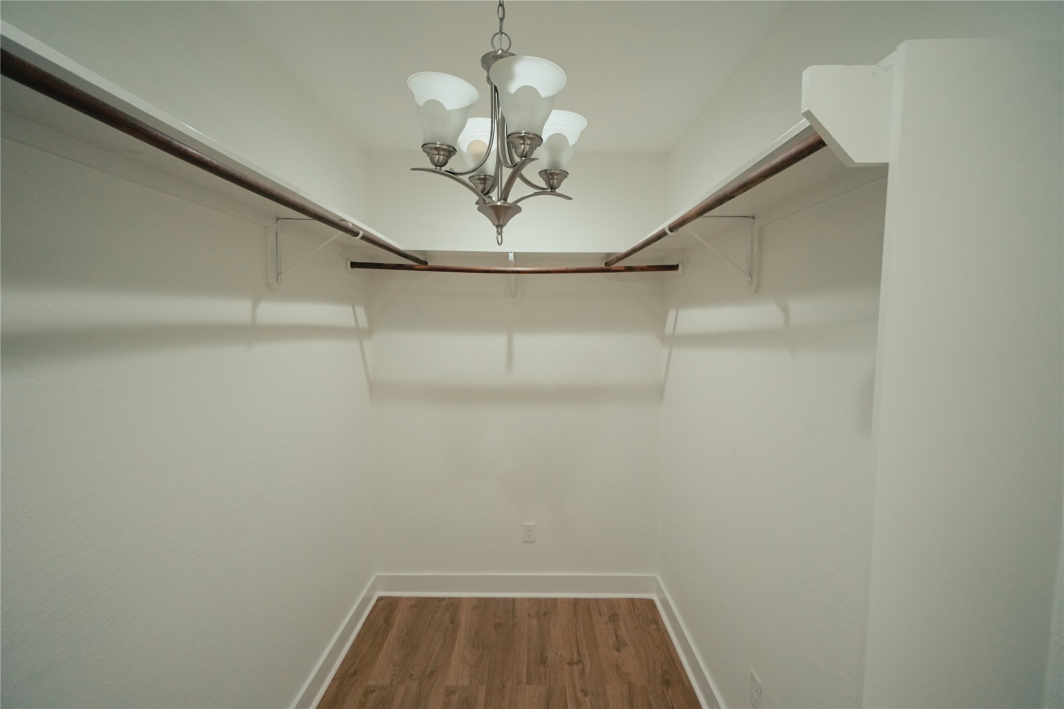 5105 Chapman Street Houston, TX 77009 - Photo 18 of 49 a view of a hallway with a chandelier fan